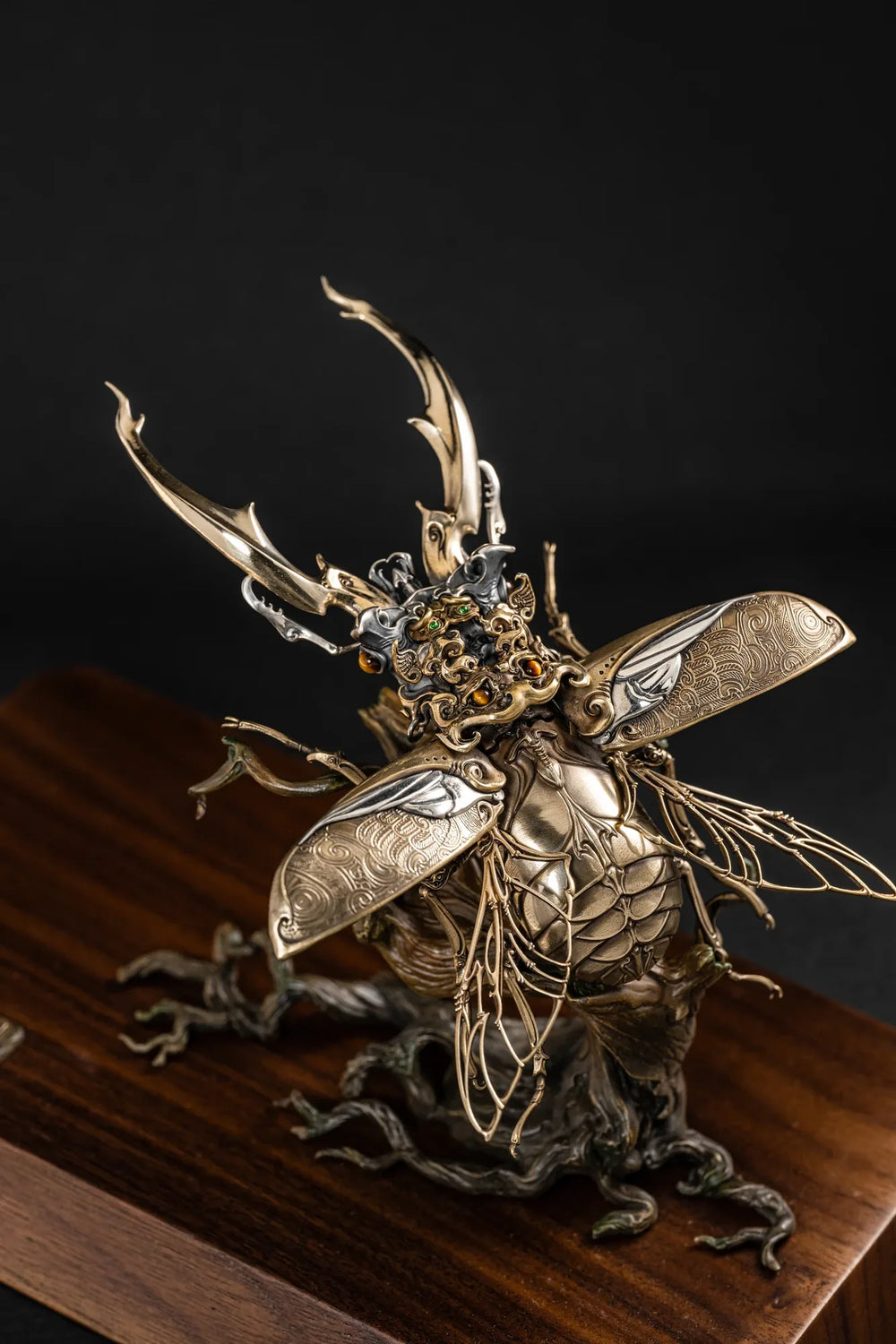 Ghostface Beetle stag beetle with its wings spread on a wooden display stand