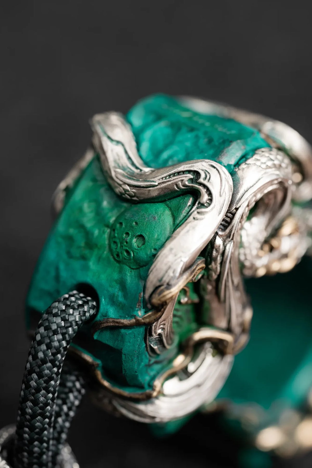 Details of the green body and sculpted serpent on the Vine Serpent accessory