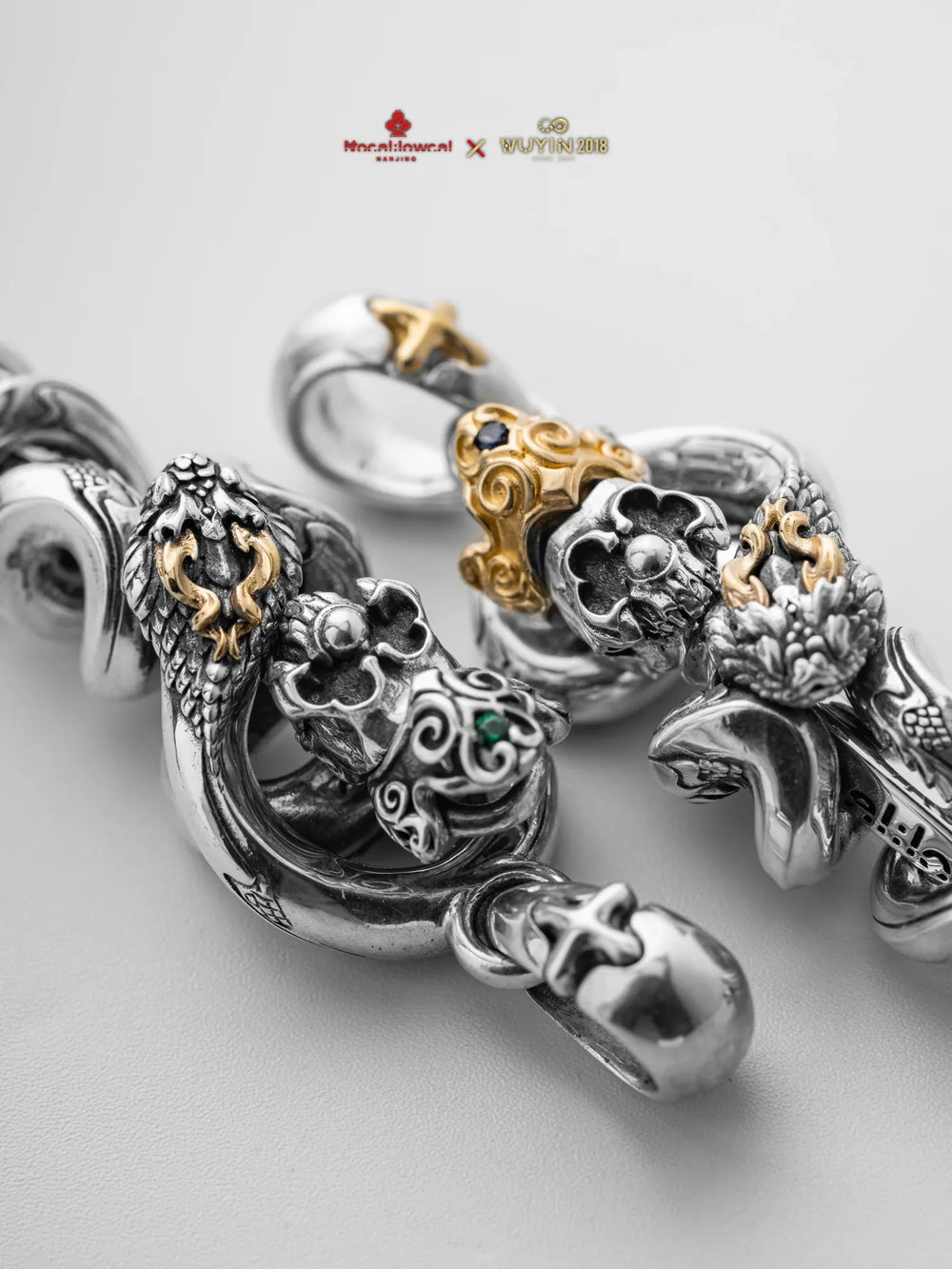 Close-up of serpent-shaped silver jewelry from the WUYIN × NOCAL:LOWCAL collaboration