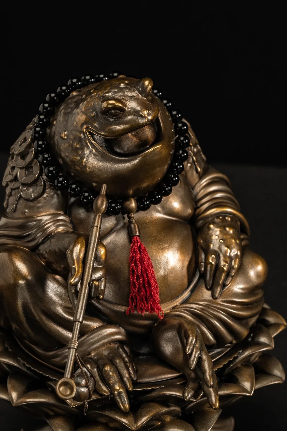 Details of the Maitreya Toad's pipe, prayer beads and lotus base