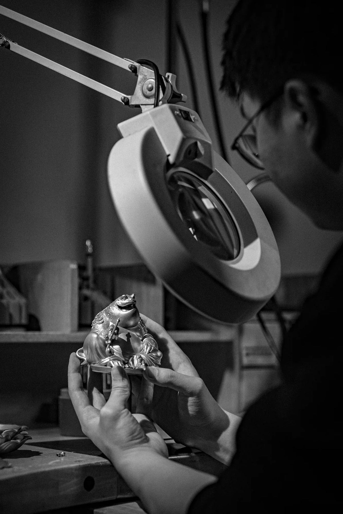 Maitreya Toad components being inspected beneath a workshop lamp