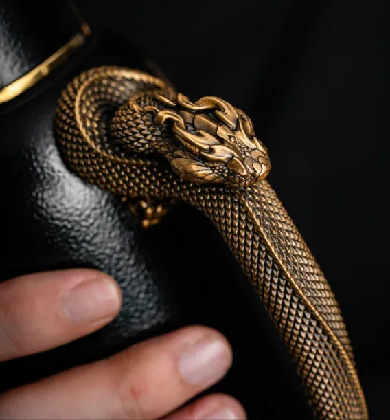 Serpent-shaped handle details on the Heirloom Teapot Mini in the Golden Qilin edition